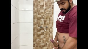 Squirting cum, bearded in a cap alone in the bathroom having fun in the handjob until cumming a lot - Rodrik Dick