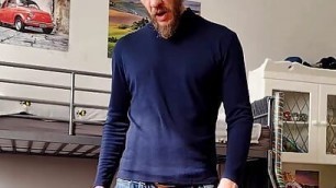 Bearded daddy jerks his dick and shows feet and ass