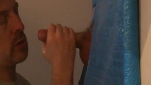 Hot sucking action at the homemade glory hole 18